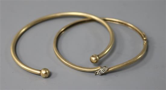 A diamond set 9ct gold hinged bangle ( one stone missing) and a yellow metal bangle, gross 19.7 grams.